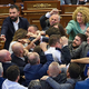 Množičen pretep v kosovskem parlamentu, poslanec polil Kurtija