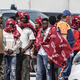 Na čolnu z migranti zagorelo, iz morja rešili skoraj 160 ljudi