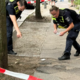 Mož izkrvavel sredi ulice, truplo žene našli v kleti hiše
