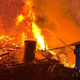FOTO: V požaru povsem uničen hlev, med intervencijo poškodovana gasilka