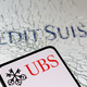UBS med pripravami na prevzem Credit Suisse prepolovila dobiček