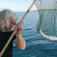 Neverjetno, kaj vse so našli v želodcu ribe, ki jo je pri Rovinju ujel slovenski ribič