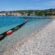 Na najbolj znani slovenski plaži se bo lesketal snežno beli soški prod