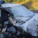 Po trku zagorel avto: Na zadnjih sedežih trije otroci, ukleščen sopotnik