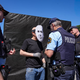 (FOTO) Protestniki so nazaj! Pred državnim zborom kolesarila črna kocka, policija že začela s pisanjem glob