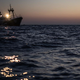 Tri Slovence sredi noči reševali na odprtem morju